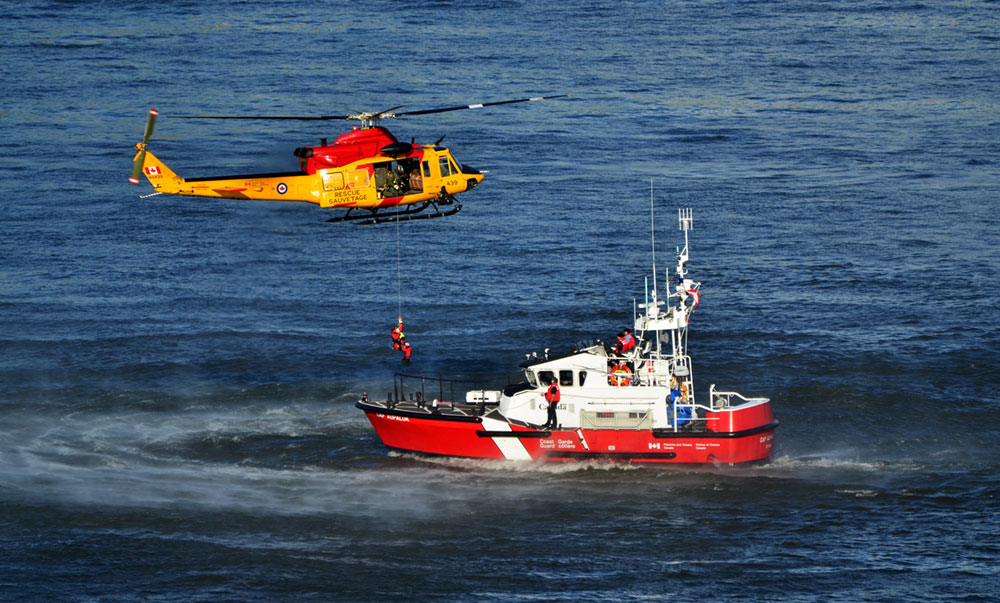 Helicopter and boat at the sea